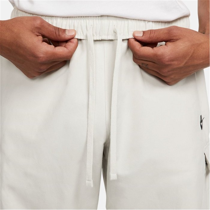 Nike Sportswear Repeat Men's Lightweight Woven Trousers. UK