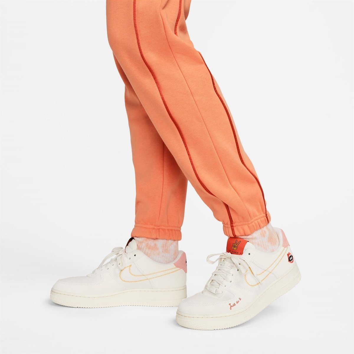 Orange nike best sale joggers womens