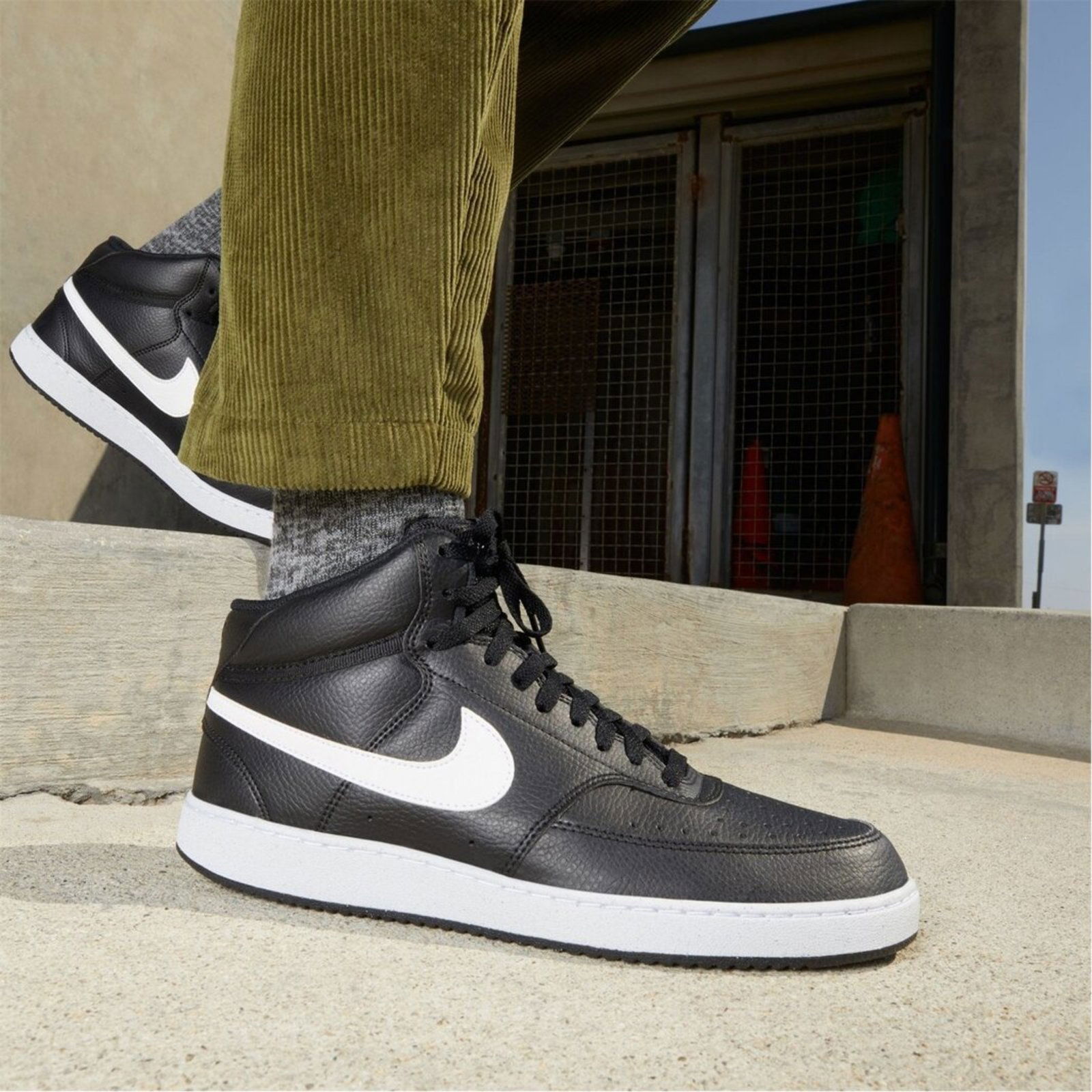 Black and white nike high top shoes best sale